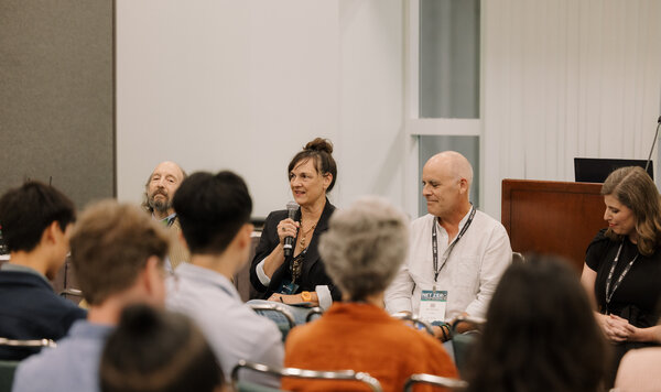 Panelists speaking to an audience at the Net Zero Conference in Los Angeles