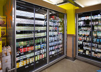 Refrigerated display case with vacuum-insulated glass doors