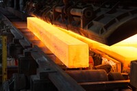  a red hot steel bar on an assembly line.