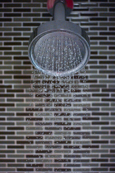 showerhead with a brick background