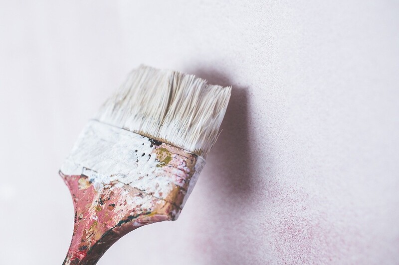 old paintbrush with white paint