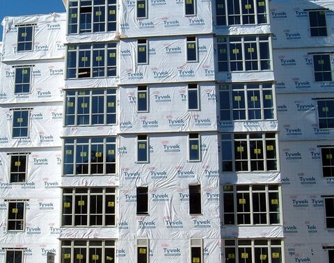 badly installed tyvek on an unfinished building