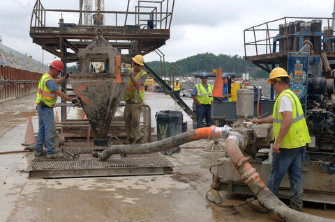  construction workers preparing to pour concrete