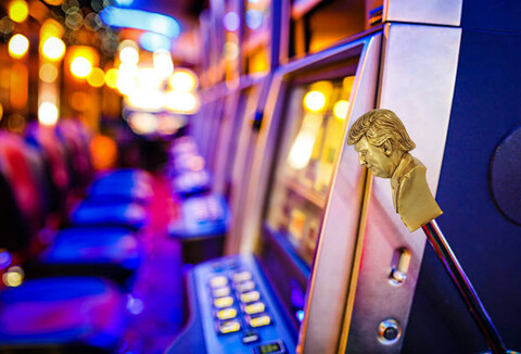 row of slot machines with golden donald trump handle